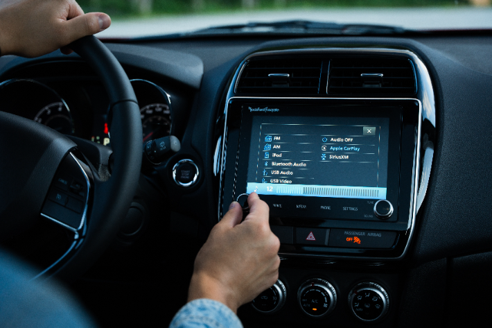 A man adjusting the volume on the RVR audio system