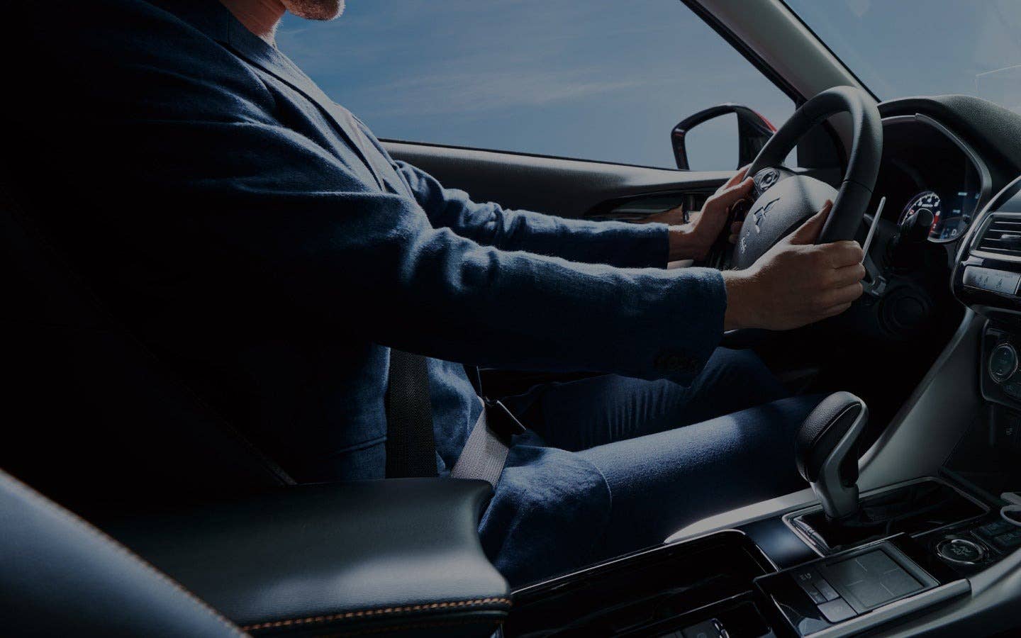 A happy driver of a Mitsubishi