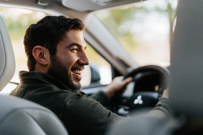 A smiling driver in the Outlander PHEV