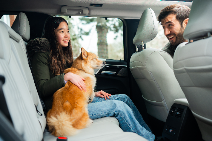 A family smiling in the Outlander PHEV